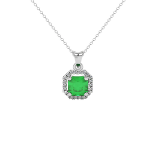 Radiant-cut emerald green gemstone stud earrings in a white gold french pavé halo setting.