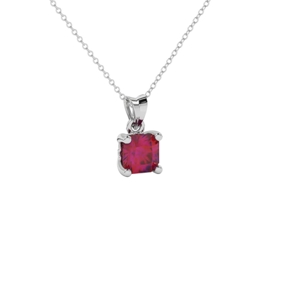 close-up of a radiant raspberry red gemstone enclosed in a white gold lotus basket pendant setting.