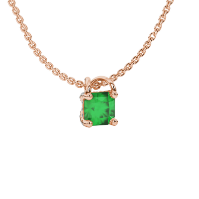 close-up shot of a radiant emerald green gemstone pendant with a rose gold pavé basket gallery.