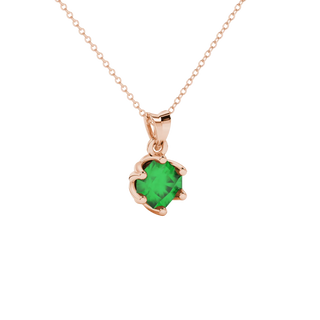 close-up shot of a radiant emerald green gemstone pendant with a rose gold scalloped six-prong design.