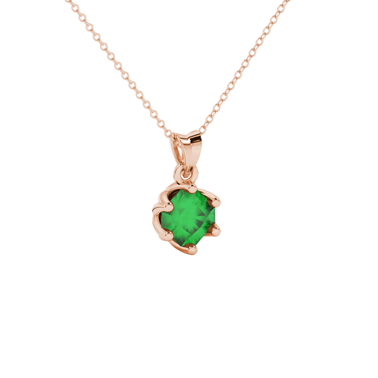 close-up shot of a radiant emerald green gemstone pendant with a rose gold scalloped six-prong design.