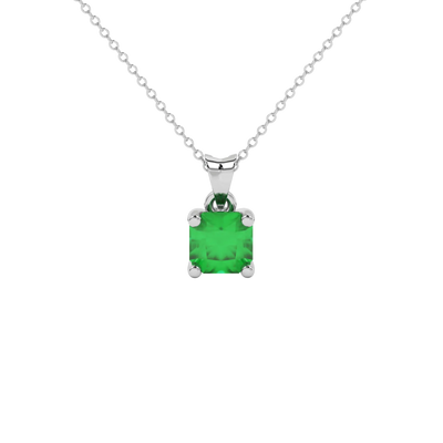 Radiant-cut emerald green gemstone pendant in a white gold surprise diamond setting.