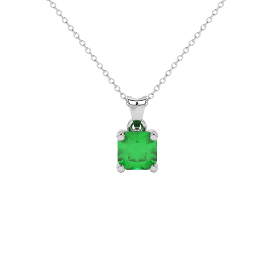 Radiant-cut emerald green gemstone pendant in a white gold surprise diamond setting.