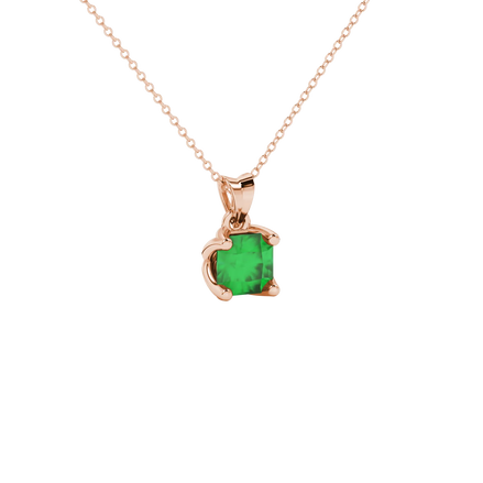close-up shot of a radiant emerald green gemstone pendant with a rose gold tulip basket gallery.
