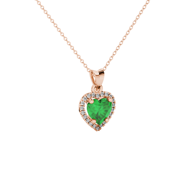 Close-up angled shot of Emerald Green heart cut halo pendant in rose gold
