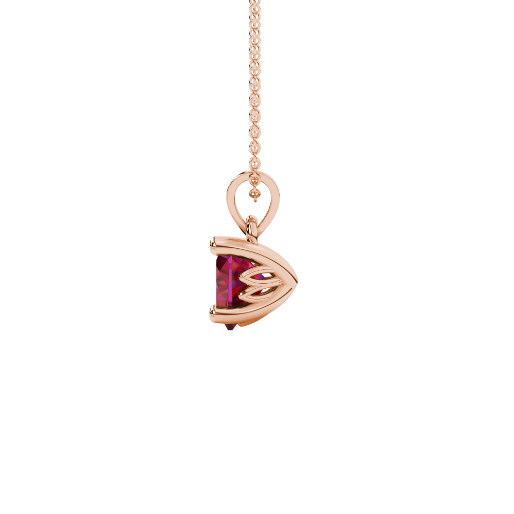 Side view of Raspberry Red heart cut gemstone pendant showcasing the rose gold