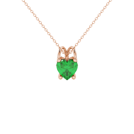 Close-up angled shot of Emerald Green heart cut pave basket halo pendant in rose gold