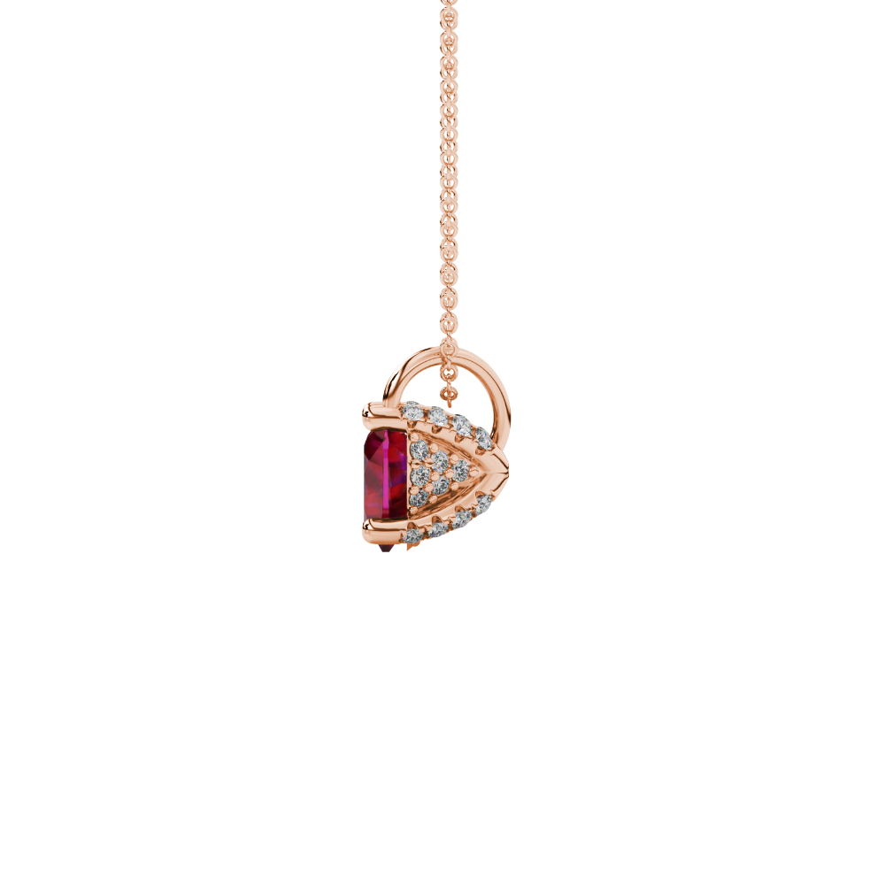Side view of Raspberry Red heart cut gemstone pendant showcasing the rose gold