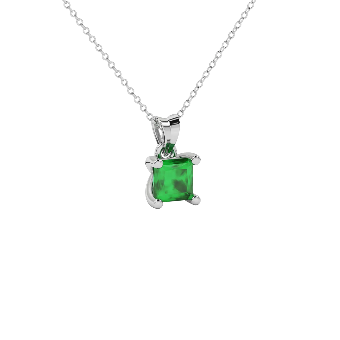 Close-up emerald green gemstone pendant, white gold four-prong setting.