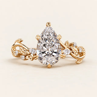Pear Cut Lab Grown Diamond Side Stone Engagement Ring in Yellow Gold