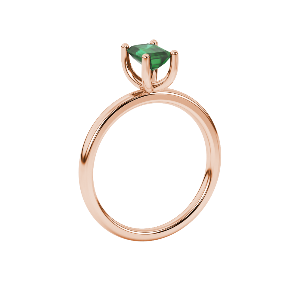 Emerald cut green gemstone solitaire ring in gold four prong setting