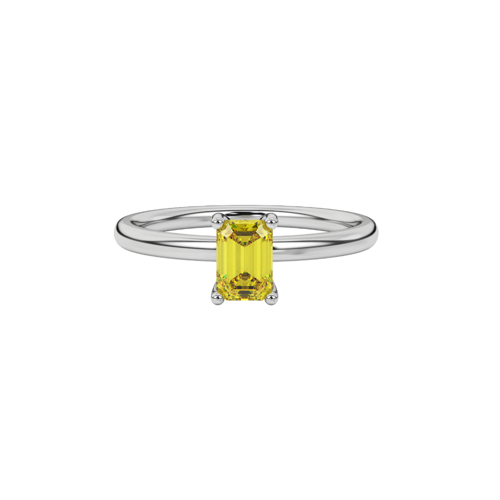 Emerald cut yellow gemstone solitaire ring in gold four prong setting