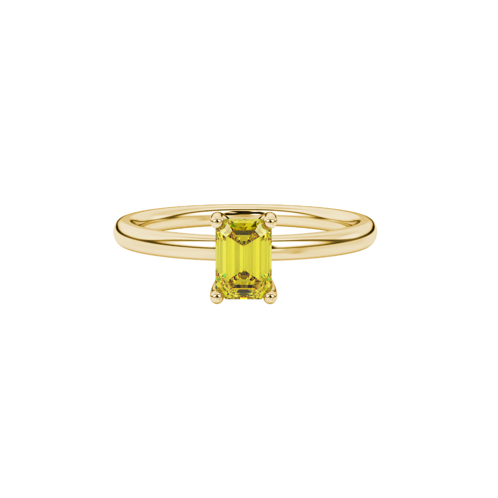 Emerald cut yellow gemstone solitaire ring in gold four prong setting