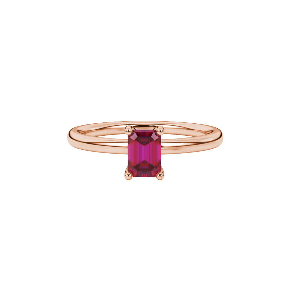Emerald cut red gemstone solitaire ring in gold four prong setting