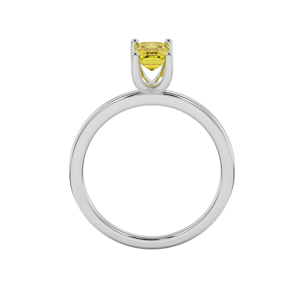 Emerald cut yellow gemstone solitaire ring in gold four prong setting
