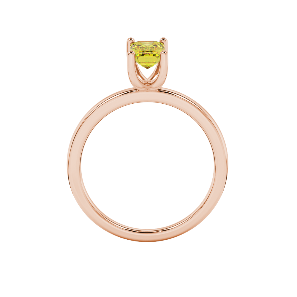 Emerald cut yellow gemstone solitaire ring in gold four prong setting