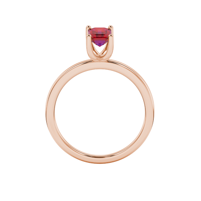 Emerald cut red gemstone solitaire ring in gold four prong setting
