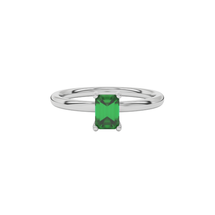 Emerald cut green gemstone solitaire ring in gold four prong setting