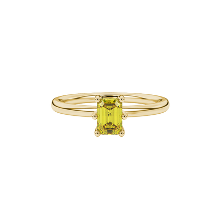 Emerald cut yellow gemstone solitaire ring in six prong gold setting