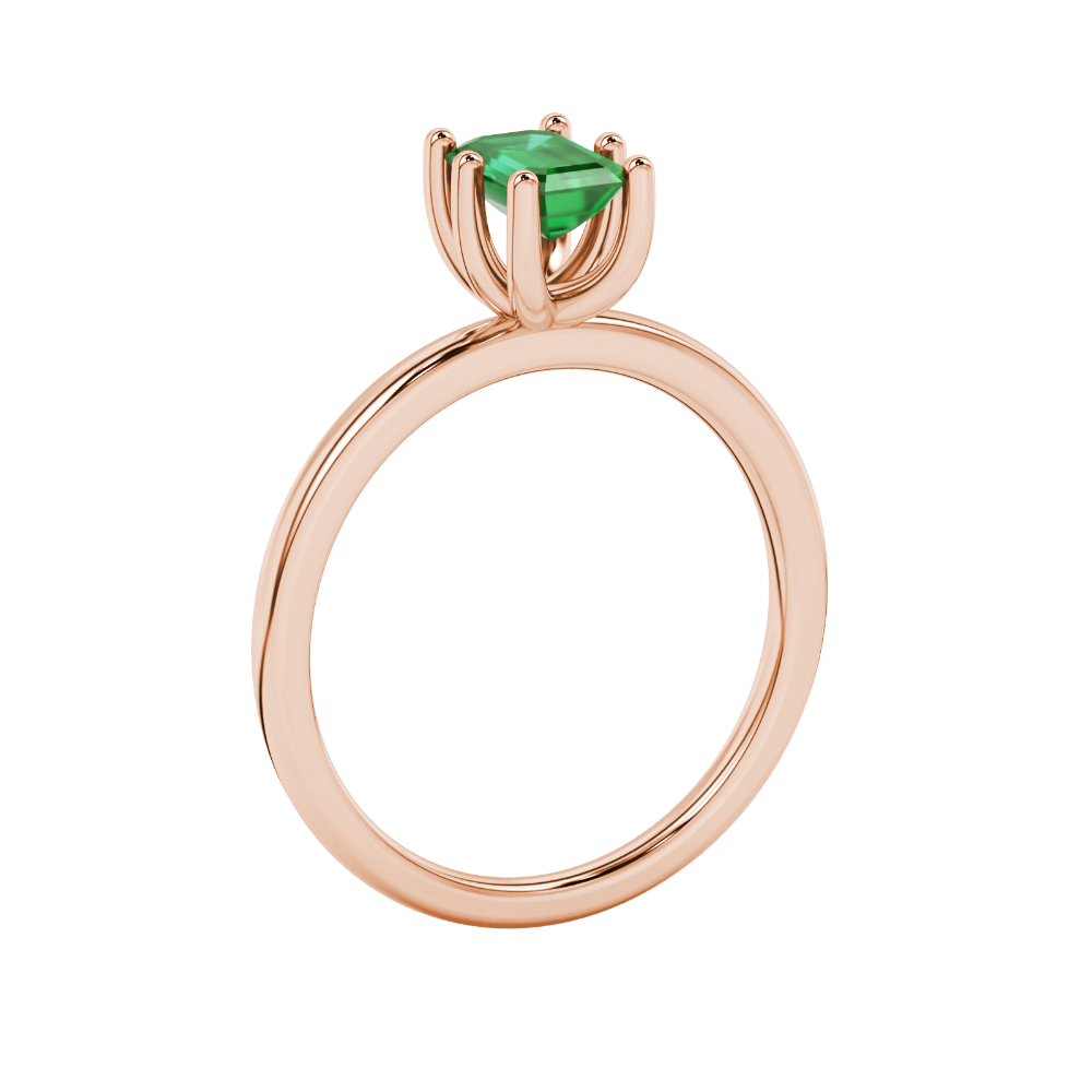 Emerald cut green gemstone solitaire ring in six prong gold setting
