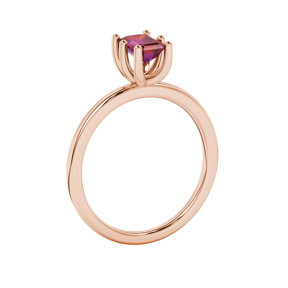 Emerald cut red gemstone solitaire ring in six prong gold setting