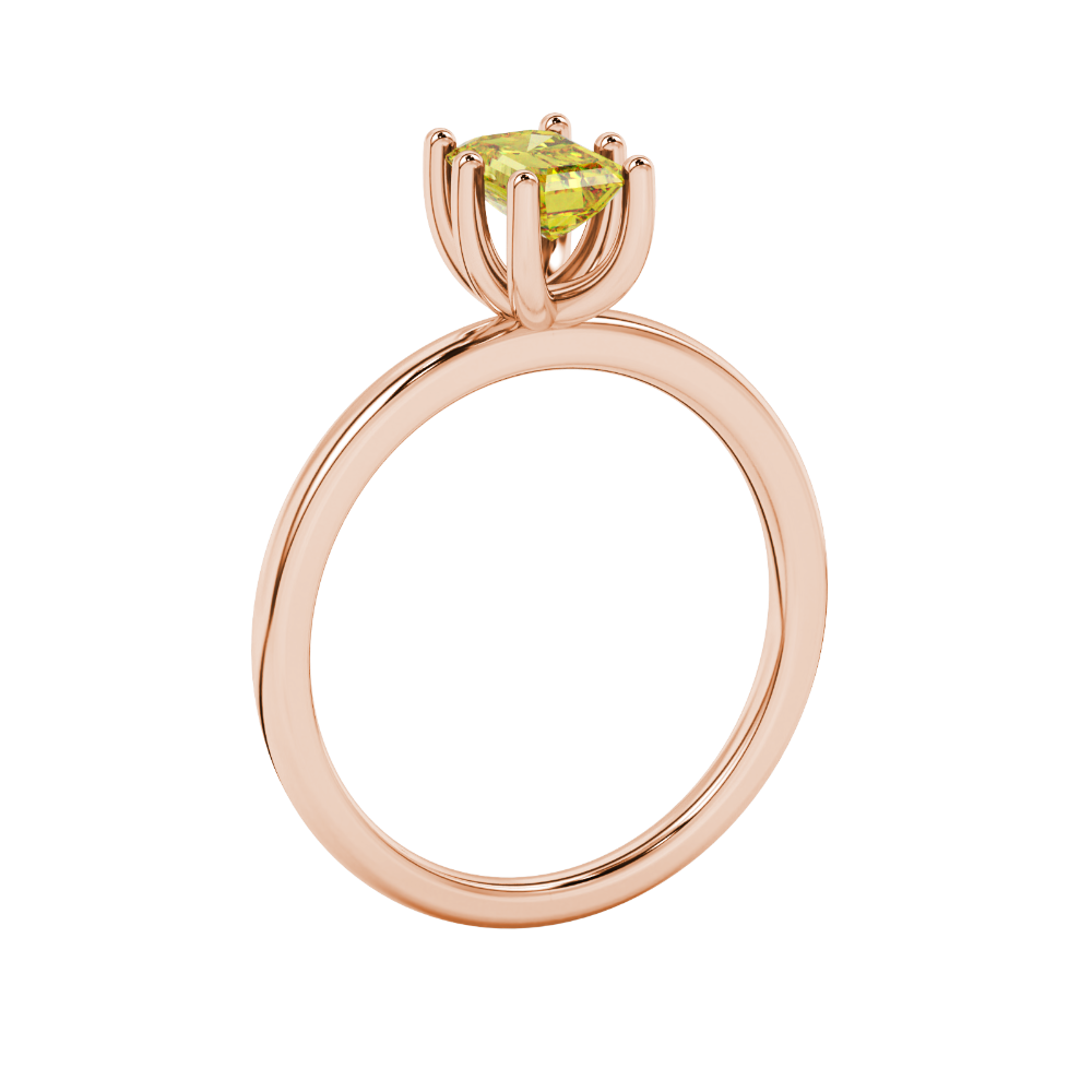 Emerald cut yellow gemstone solitaire ring in six prong gold setting