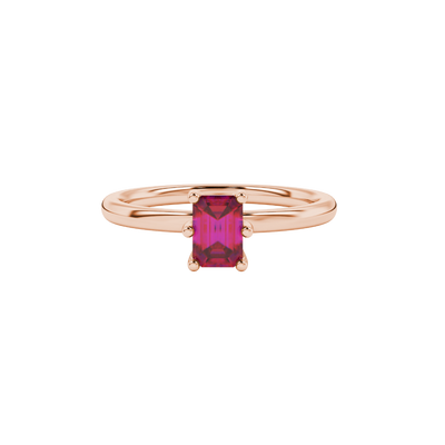 Emerald cut red gemstone solitaire ring in six prong gold setting