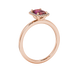 Red emerald cut gemstone halo ring with split shank band and diamond accents