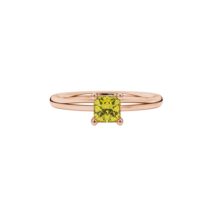 Close-up, princess canary yellow gemstone ring, rose gold basket setting.