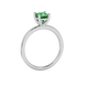 Side profile, white gold emerald green ring, classic basket gallery.