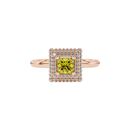 Close-up, princess canary yellow gemstone ring, rose gold halo setting.