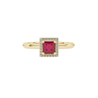 Close-up, princess raspberry red gemstone, yellow gold pavé ring.