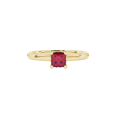 Close-up, princess raspberry red gemstone, yellow gold lotus ring.