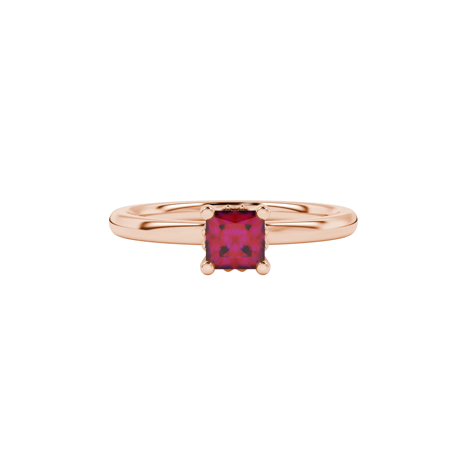Close-up, princess raspberry red gemstone ring, rose gold lotus setting.
