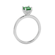 Side profile, white gold emerald green ring, pavé basket gallery.