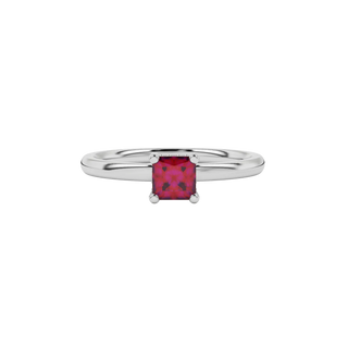 Close-up raspberry red gemstone ring, white gold basket setting.