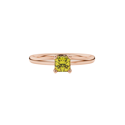 Close-up, princess canary yellow gemstone ring, rose gold basket setting.