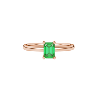 emerald green emerald cut solitaire gemstone ring with hidden diamond accent in rose gold