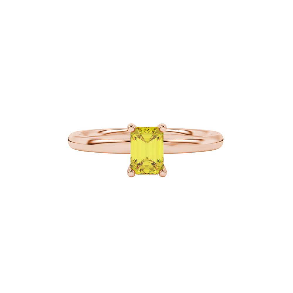 Emerald cut yellow gemstone ring featuring elegant solitaire setting