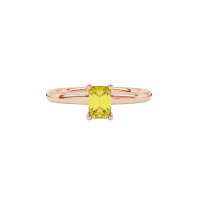Emerald cut yellow gemstone ring featuring elegant solitaire setting