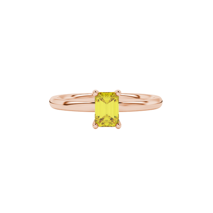 Emerald cut yellow gemstone ring featuring elegant solitaire setting