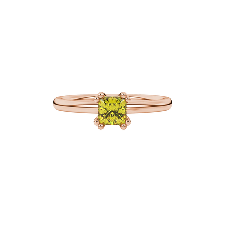 Close-up, princess canary yellow gemstone ring, rose gold vintage setting.