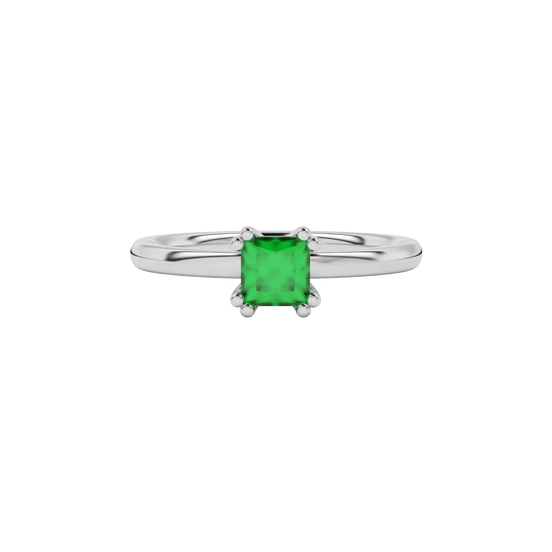 Close-up emerald green gemstone ring, white gold vintage setting.