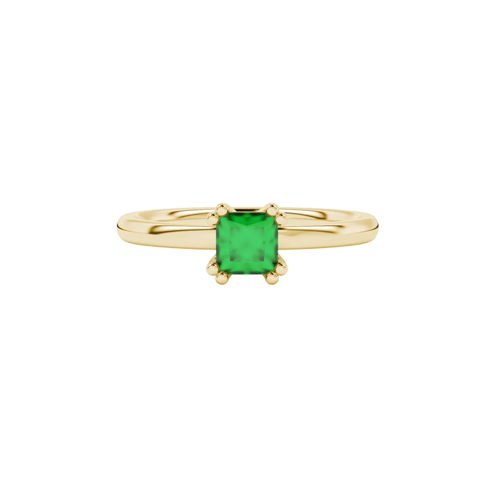 Close-up, princess emerald green gemstone, yellow gold vintage ring.