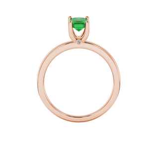 emerald green emerald cut solitaire gemstone ring with hidden diamond accent in rose gold