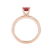 Pear shape raspberry red gemstone ring, rose gold four-prong setting.