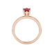Pear shape raspberry red gemstone ring, rose gold six-prong setting.