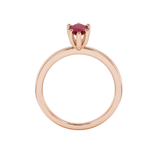Pear shape raspberry red gemstone ring, rose gold six-prong setting.