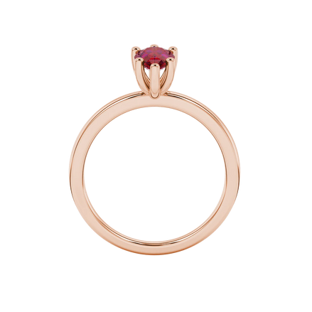 Pear shape raspberry red gemstone ring, rose gold six-prong setting.