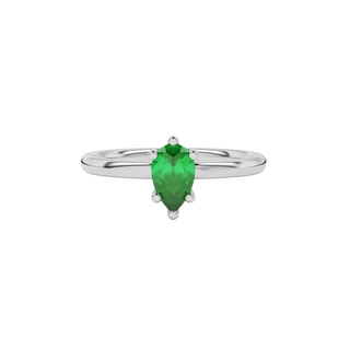 Close-up emerald green gemstone ring, white gold six-prong setting.